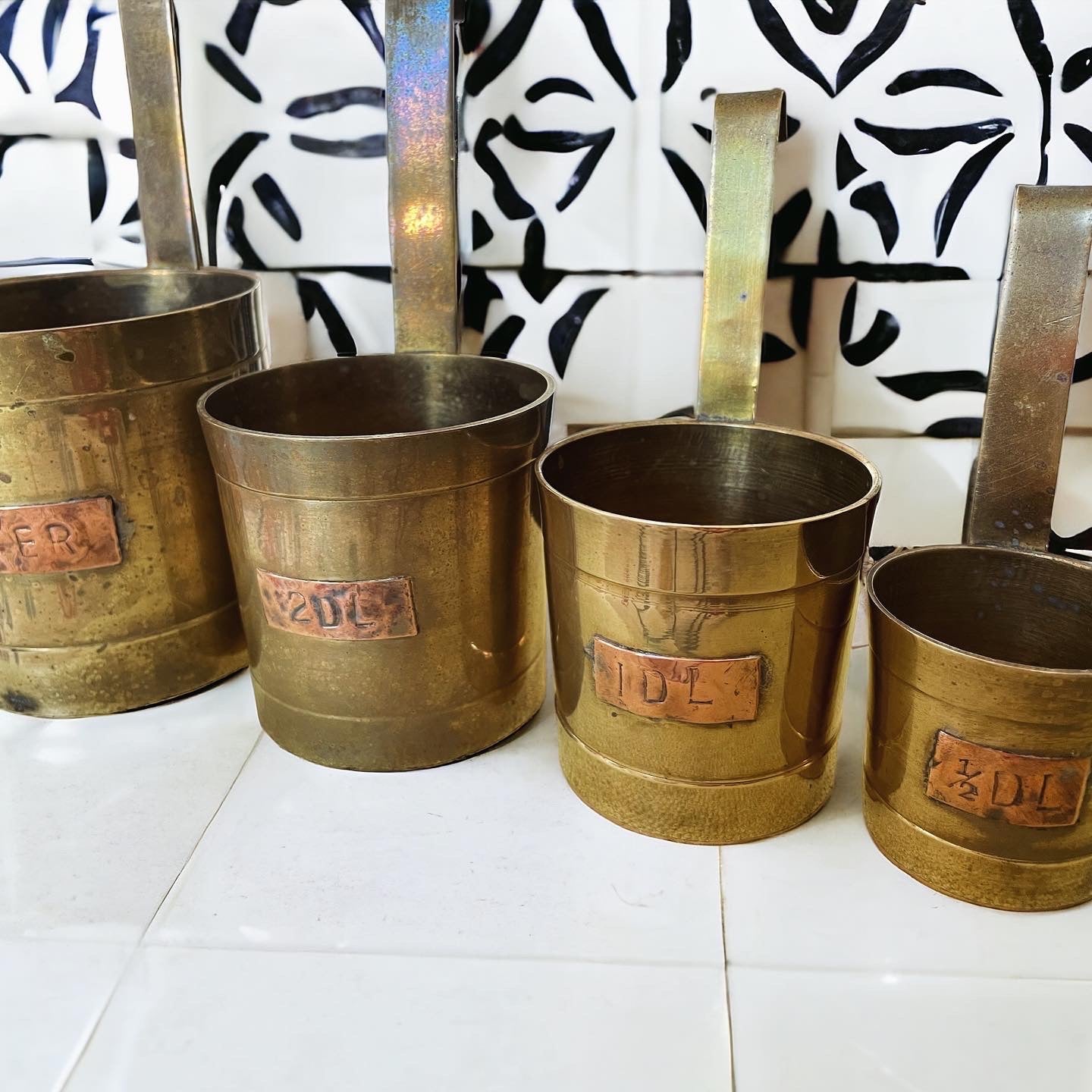 Set of 4 old apothecary measures