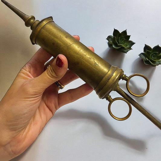 Large antique brass syringe from the late 19th century