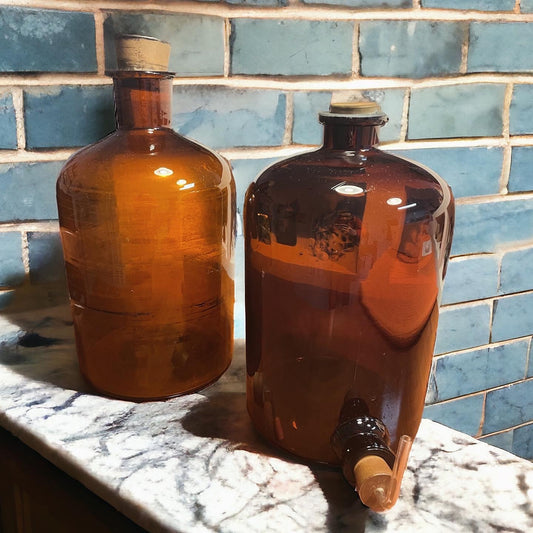 Pair of large glass bottles 1900