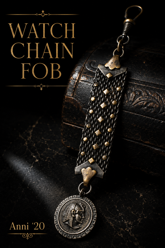 Albert chain da panciotto con maglia argentata e placchette dorate, breloque egittizzante, primo ‘900