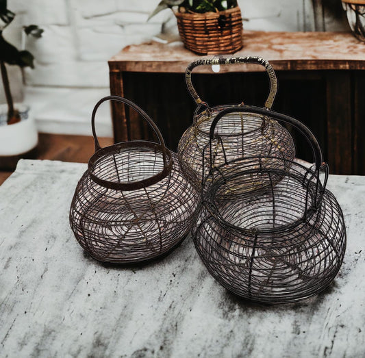 Tris of antique egg baskets