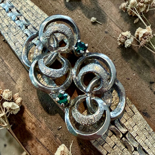 Bracciale in argento massiccio semirigido anni 60 modernista, con centrale lavorato e pietre