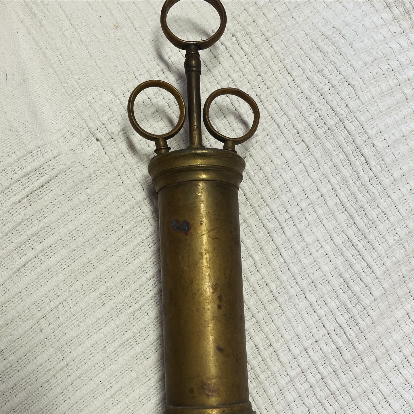 Large antique brass syringe from the late 19th century