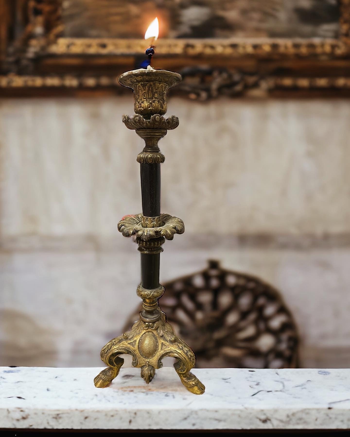 Sacred candlestick with hoofed feet