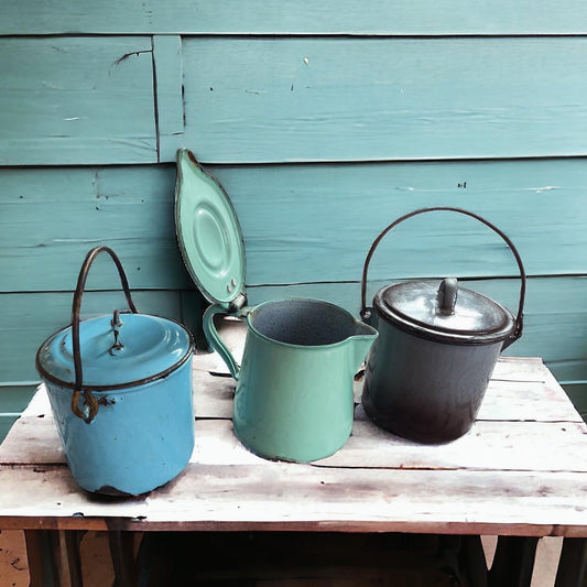 Set of three enameled saucepans and jug