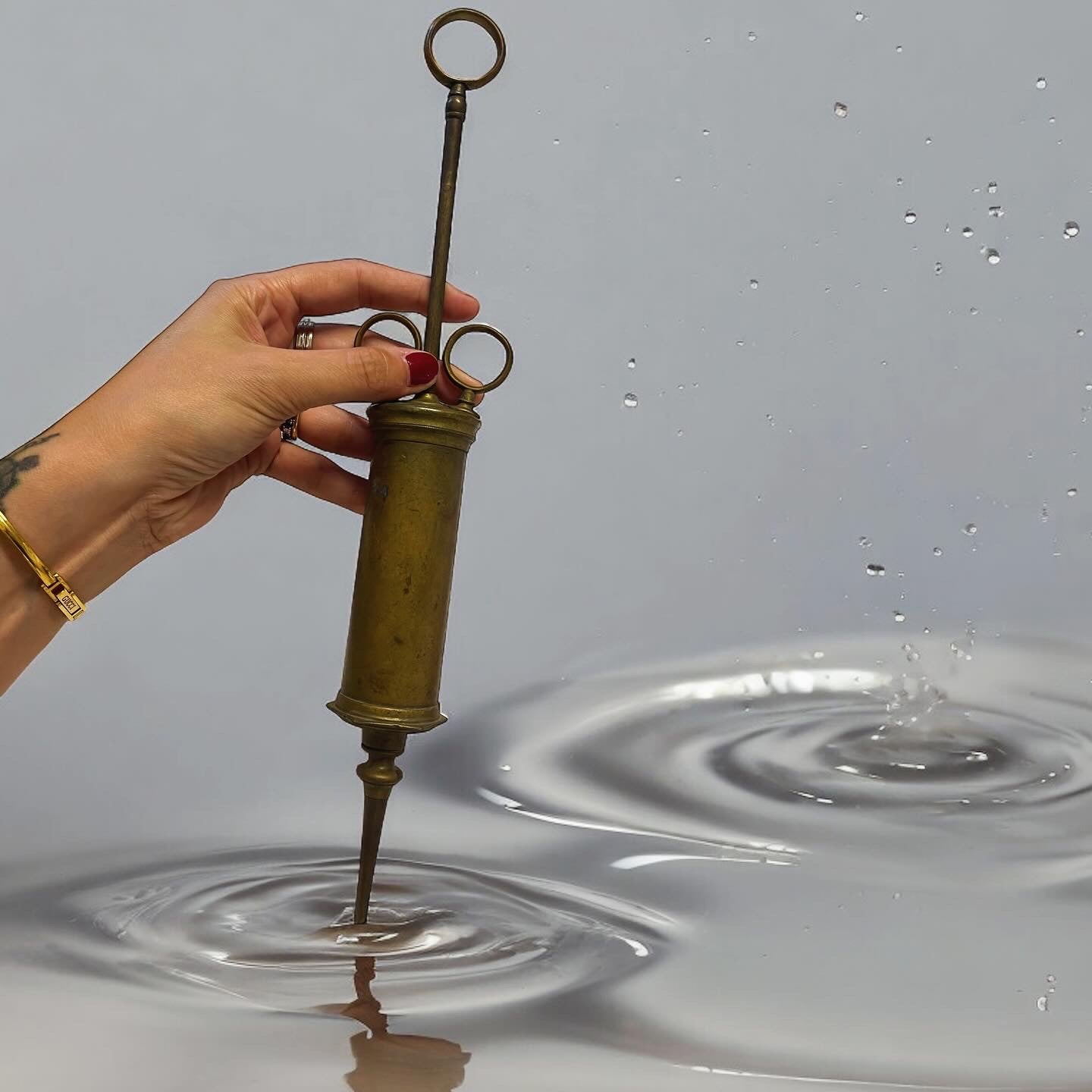 Large antique brass syringe from the late 19th century