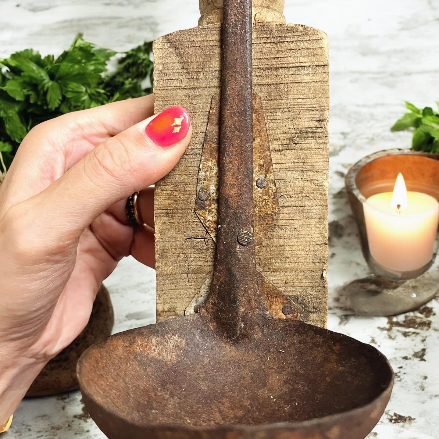 Antique rustic wooden candelabra with ladle