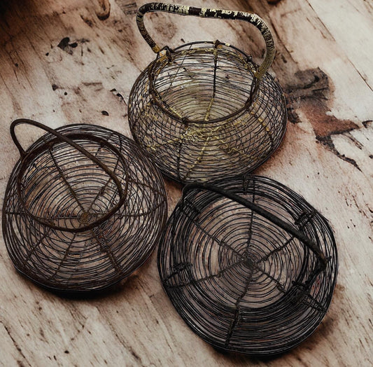 Tris of antique egg baskets