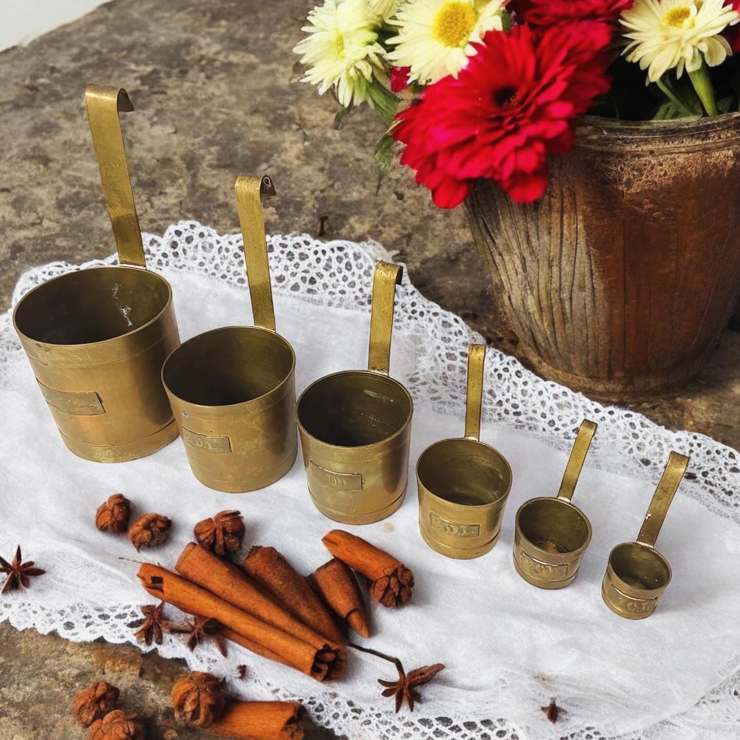 Set of antique Dutch workshop brass measuring cups