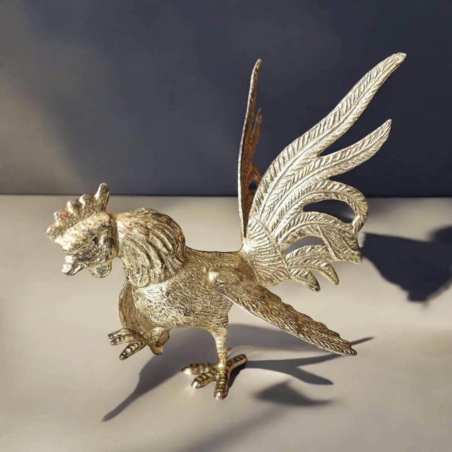 Pair of silver rooster sculptures from the 50s