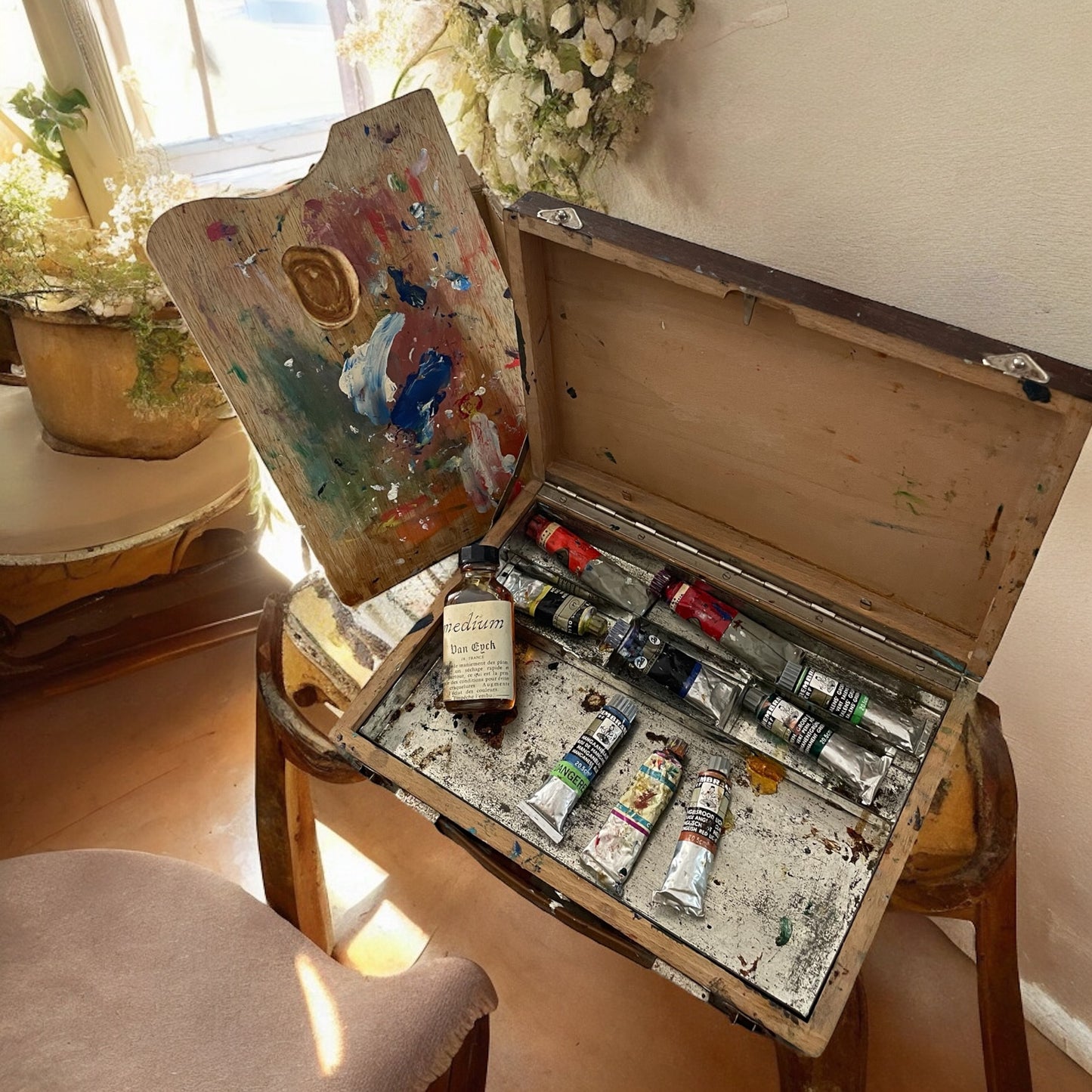 Painter's case with colors and palette