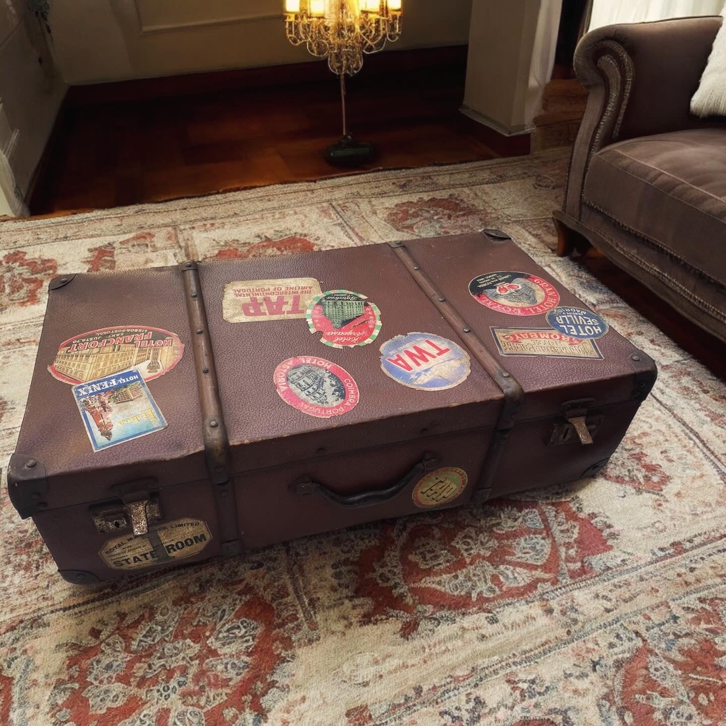 Set of three antique suitcases from 1900 with vintage stickers