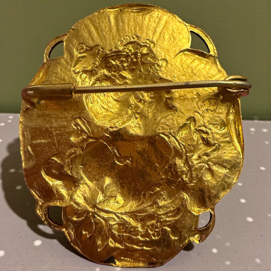 Spilla Art Nouveau dorata con archetipo di donna primissimo ‘900