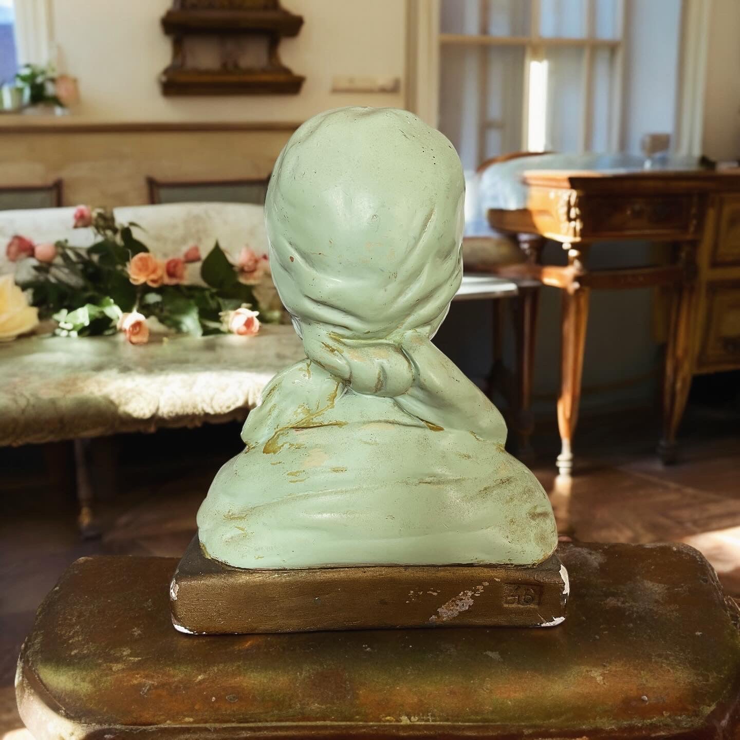 Art Deco bust of a young girl in the village