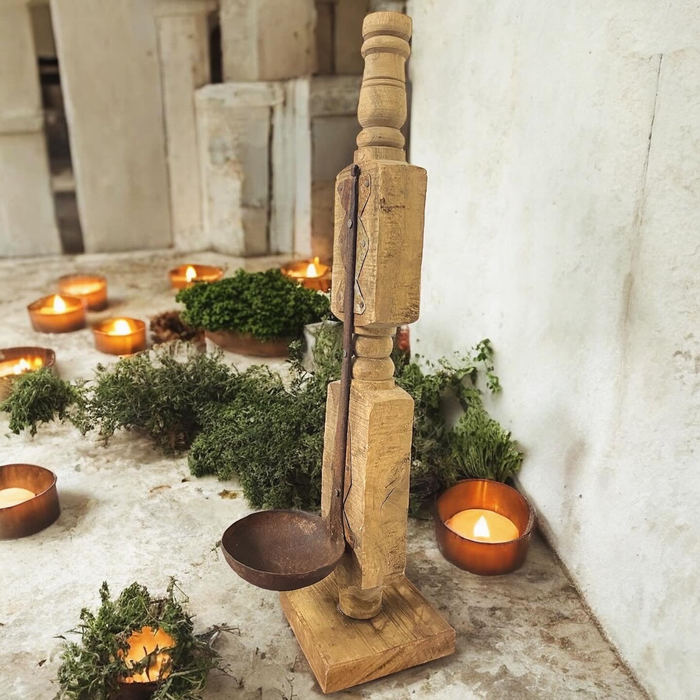 Antique rustic wooden candelabra with ladle