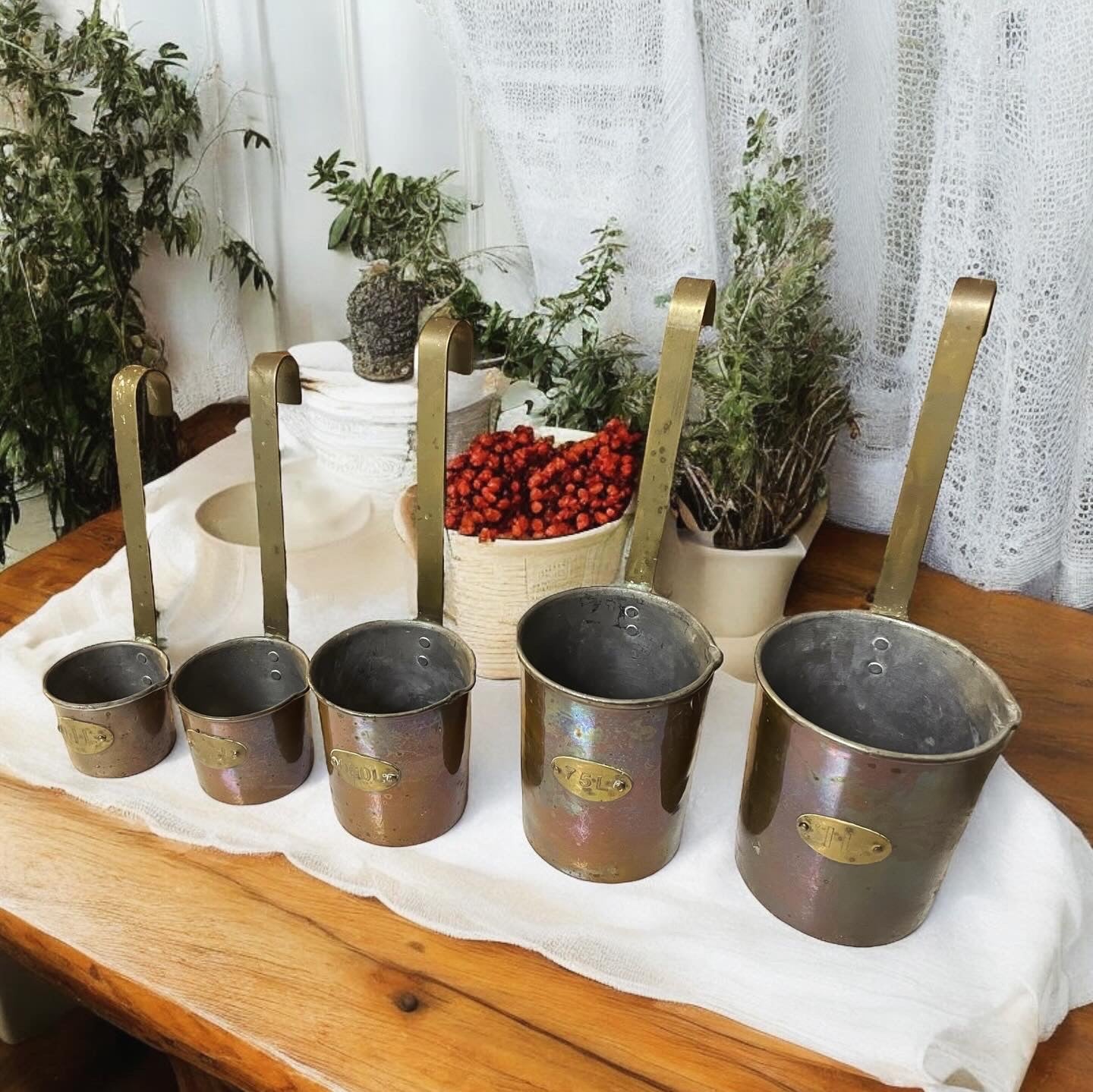 Set of antique copper measuring cups Dutch workshop