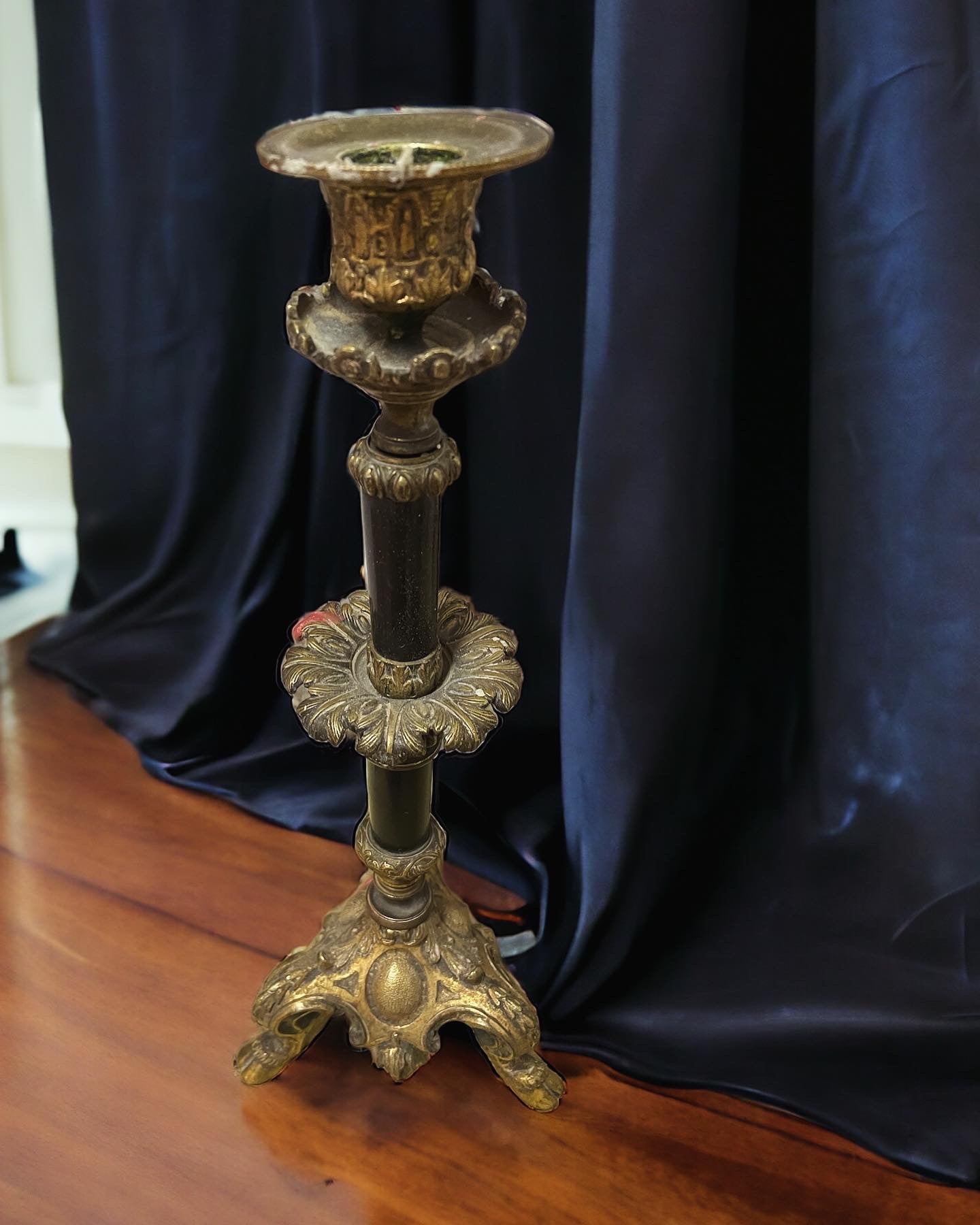 Sacred candlestick with hoofed feet