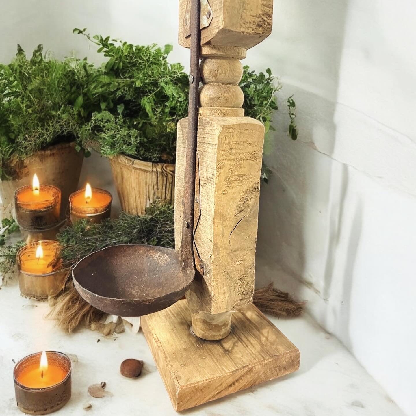 Antique rustic wooden candelabra with ladle