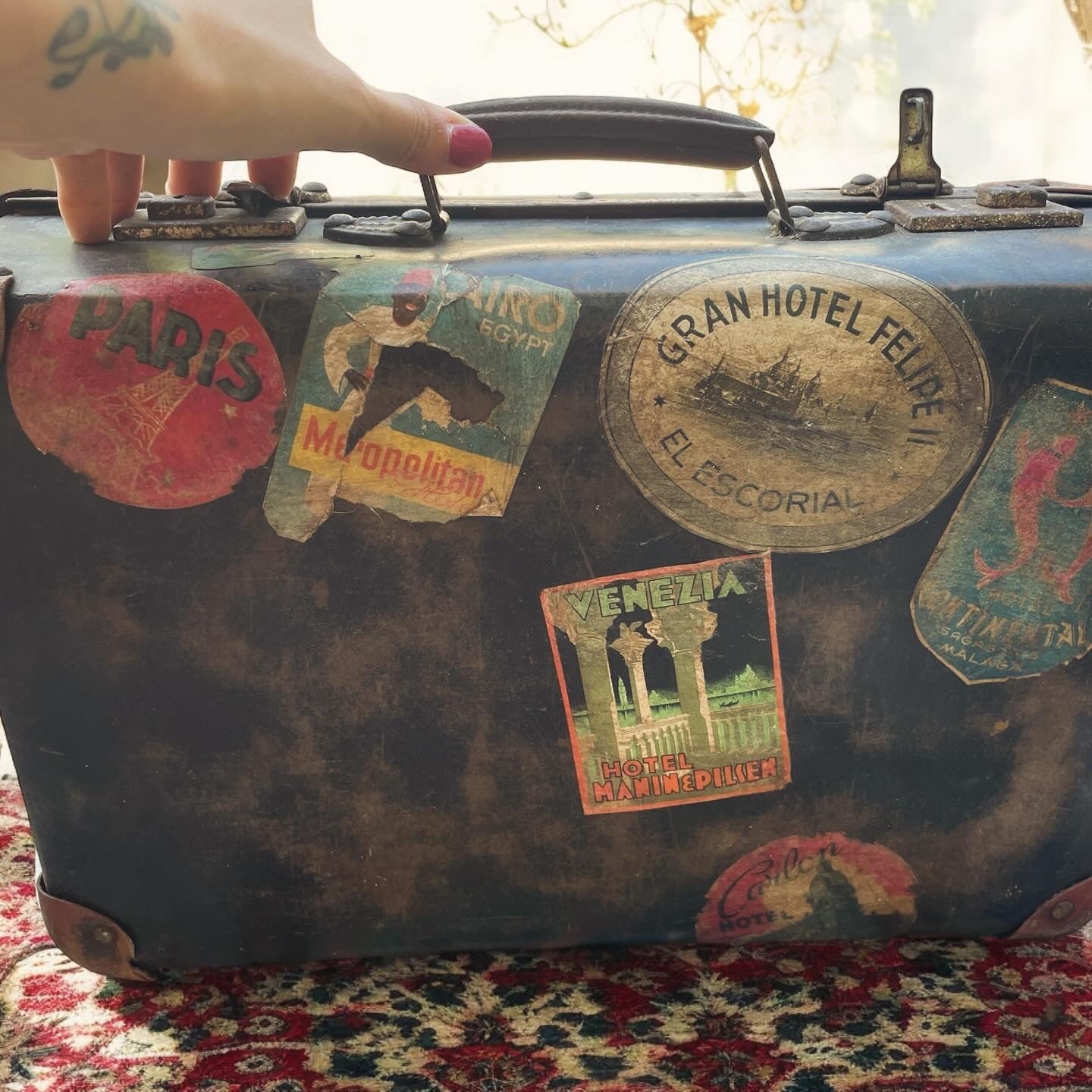 Set of three antique suitcases from 1900 with vintage stickers