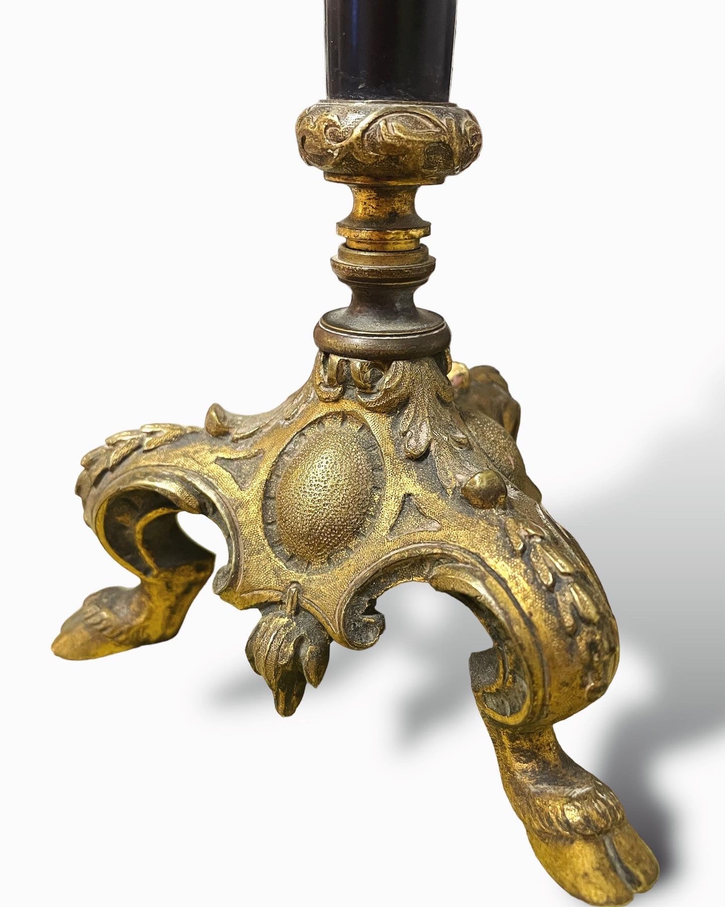 Sacred candlestick with hoofed feet