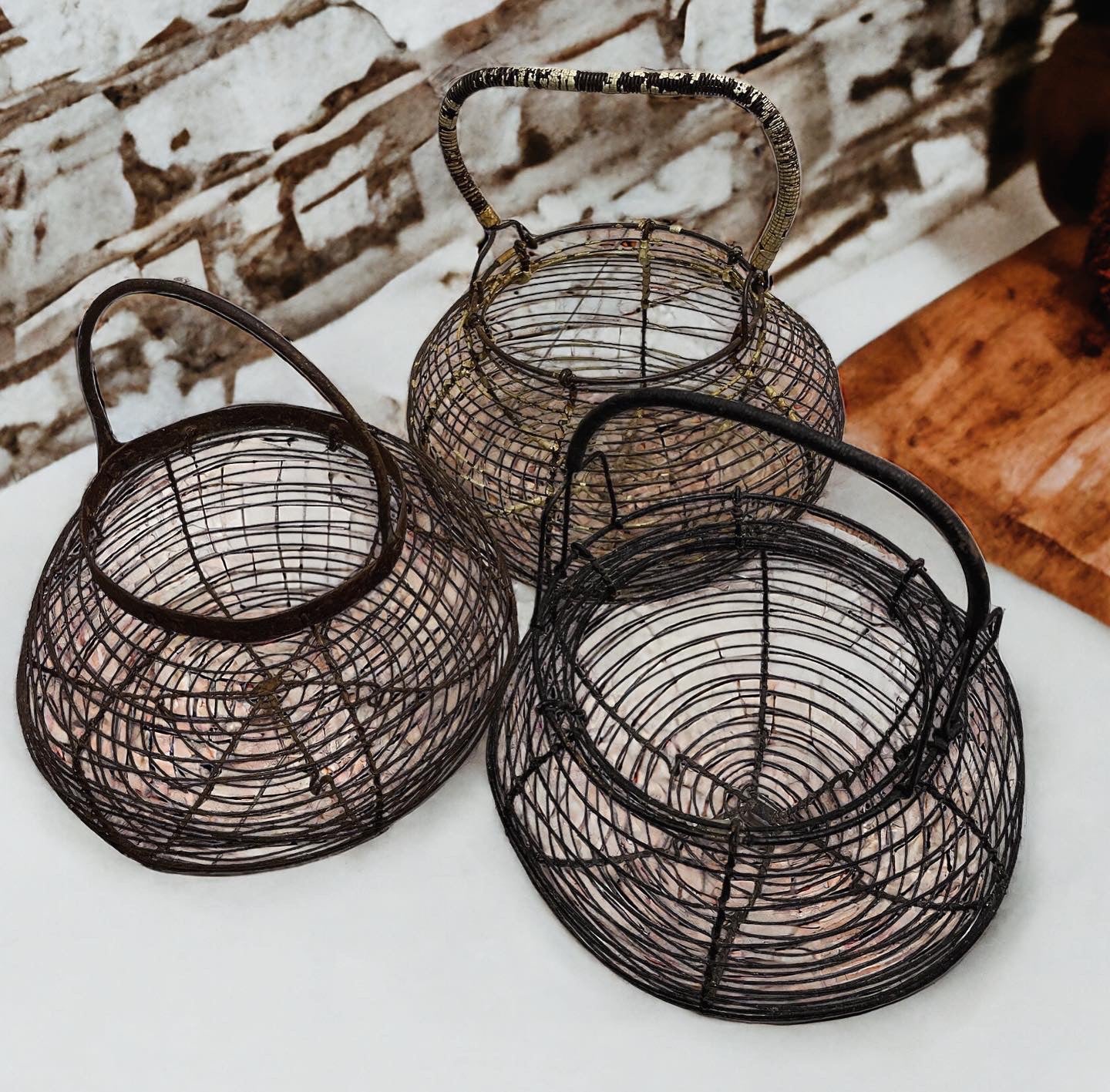 Tris of antique egg baskets