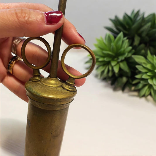 Large antique brass syringe from the late 19th century