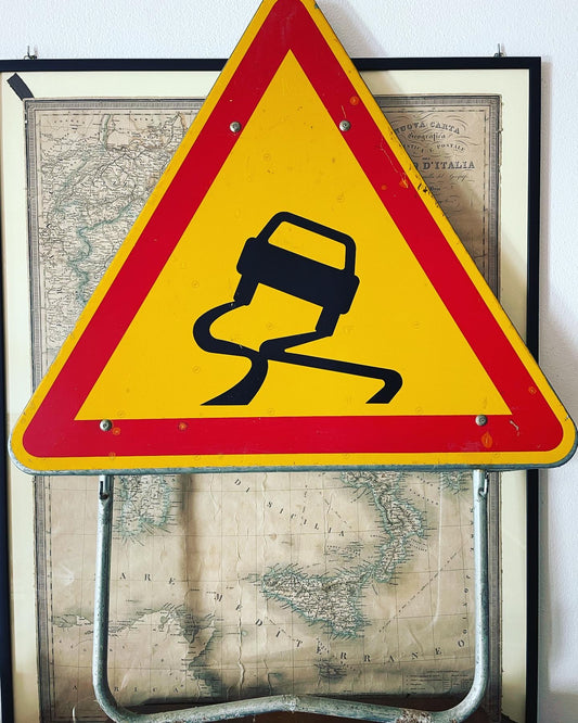 Slippery road sign