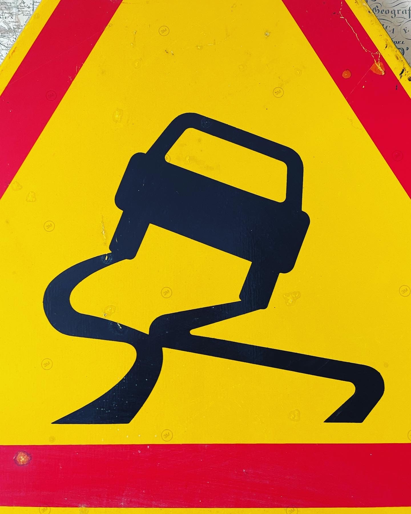 Slippery road sign